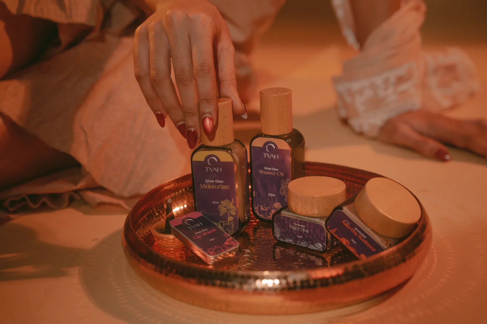 TVAH ritual still-life — jars of washed-ghee skincare